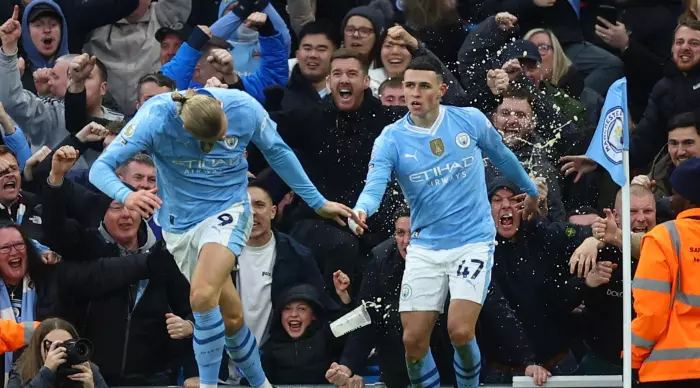 Phil Foden and Erling Holland celebrate (Reuters)
