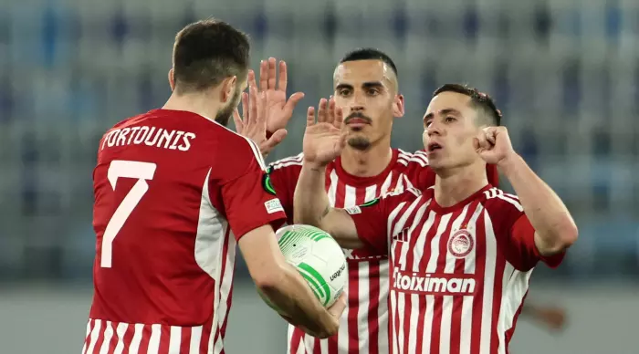 Kostas Fortunis celebrates with his friends (Reuters)