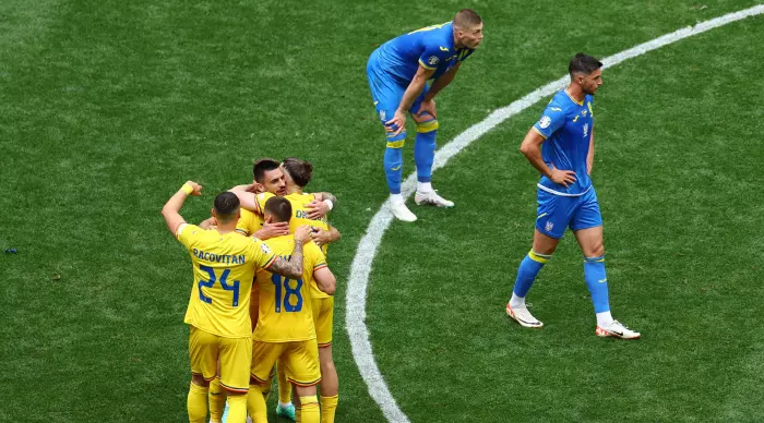 The Romanians celebrate at the end (Reuters)