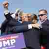 Former President Donald Trump is rushed offstage during a rally on July 13, 2024 in Butler, Pa., after an attempted assassination.