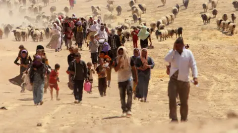 Reuters Yazidis flee Islamic State in 2014 in Iraq