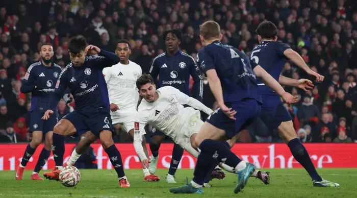 Kai Hubertz squeezes a penalty from Harry Maguire (Reuters)